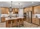 Modern kitchen with stainless steel appliances and island at 2471 Overfalls Pl, Wesley Chapel, FL 33543