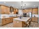 Modern kitchen with stainless steel appliances and island at 2471 Overfalls Pl, Wesley Chapel, FL 33543