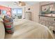 Comfortable main bedroom with ocean view and ample dresser space at 2504 Gulf Blvd # 308, Indian Rocks Beach, FL 33785