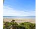 Stunning view of a wide sandy beach and ocean at 2504 Gulf Blvd # 308, Indian Rocks Beach, FL 33785