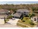 Two-story house with a three-car garage and a large front yard at 26932 Sea Breeze Way, Wesley Chapel, FL 33544