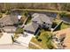 Two-story house with a three-car garage and a large front yard at 26932 Sea Breeze Way, Wesley Chapel, FL 33544