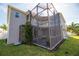 Two-story house with a screened patio and balcony at 26932 Sea Breeze Way, Wesley Chapel, FL 33544