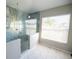 Elegant bathroom with a large walk-in shower and marble flooring at 26932 Sea Breeze Way, Wesley Chapel, FL 33544