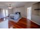 Spacious bedroom with hardwood floors and access to a private balcony at 26932 Sea Breeze Way, Wesley Chapel, FL 33544