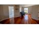Bright bedroom with hardwood floors and access to a private sitting area at 26932 Sea Breeze Way, Wesley Chapel, FL 33544