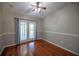 Hardwood floor bedroom with access to private deck at 26932 Sea Breeze Way, Wesley Chapel, FL 33544