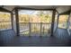 Screened-in back porch overlooking a pond and lush landscape at 26932 Sea Breeze Way, Wesley Chapel, FL 33544