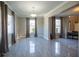 Formal dining room with large windows, neutral walls, and tile flooring at 26932 Sea Breeze Way, Wesley Chapel, FL 33544