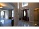 Bright and spacious entryway with elegant flooring and a view into the living room at 26932 Sea Breeze Way, Wesley Chapel, FL 33544