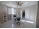 Home office with built-in shelving and a workspace at 26932 Sea Breeze Way, Wesley Chapel, FL 33544