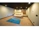 Basement home theater with projector and comfortable seating at 26932 Sea Breeze Way, Wesley Chapel, FL 33544