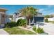 House exterior with a two-car garage and basketball hoop at 26932 Sea Breeze Way, Wesley Chapel, FL 33544