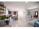 Open concept kitchen with island, breakfast bar, and Gathering room views at 26932 Sea Breeze Way, Wesley Chapel, FL 33544