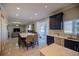 Open concept kitchen with island, dining area, and views of Gathering room at 26932 Sea Breeze Way, Wesley Chapel, FL 33544