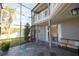Comfortable screened patio with seating area and view of the backyard at 26932 Sea Breeze Way, Wesley Chapel, FL 33544