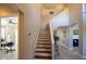 Modern staircase with hardwood treads and neutral walls at 26932 Sea Breeze Way, Wesley Chapel, FL 33544