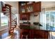 Elegant wet bar with granite countertop and wine storage at 26932 Sea Breeze Way, Wesley Chapel, FL 33544