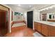 A large bathroom with a walk-in shower, separate tub, and a double sink vanity at 2902 Big Cypress Way, Wesley Chapel, FL 33544