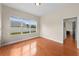 Empty bedroom with hardwood floors, ample natural light, and neutral color palette at 2902 Big Cypress Way, Wesley Chapel, FL 33544