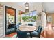 Breakfast nook with views of outdoor living area, pool, and well maintained backyard at 2902 Big Cypress Way, Wesley Chapel, FL 33544