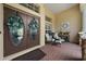 Front porch with double doors, brick flooring, and seating at 2902 Big Cypress Way, Wesley Chapel, FL 33544