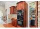Gourmet kitchen featuring built-in double ovens and a walk-in pantry at 2902 Big Cypress Way, Wesley Chapel, FL 33544