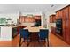 Spacious kitchen island with seating and cooktop, perfect for entertaining at 2902 Big Cypress Way, Wesley Chapel, FL 33544