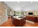 Kitchen island and adjacent living spaces create an ideal entertaining space at 2902 Big Cypress Way, Wesley Chapel, FL 33544