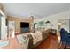 Bright living room featuring hardwood floors, a large sectional couch, and tv set at 2902 Big Cypress Way, Wesley Chapel, FL 33544