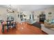 Open-concept living room with hardwood floors and plenty of natural light at 2902 Big Cypress Way, Wesley Chapel, FL 33544