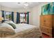 Spacious main bedroom with an ensuite bath, ceiling fan, and a sliding glass door to the backyard at 2902 Big Cypress Way, Wesley Chapel, FL 33544