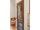 View of pantry with wooden and glass door, interior shelves, and storage cabinet at 2902 Big Cypress Way, Wesley Chapel, FL 33544