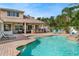 Outdoor pool with an outdoor bar and lounge area, great for relaxing and entertaining guests at 2902 Big Cypress Way, Wesley Chapel, FL 33544