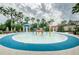 Community splash pad with colorful fountains and blue accents, surrounded by mature palms at 2902 Big Cypress Way, Wesley Chapel, FL 33544