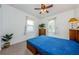 Cozy bedroom with a ceiling fan and plenty of natural light at 308 E Ross Ave, Tampa, FL 33602