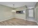 Dining area with wood-look floors and access to the entryway at 356 Bay Pl, Safety Harbor, FL 34695