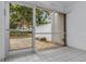 Cozy screened porch with tiled floor and access to patio at 356 Bay Pl, Safety Harbor, FL 34695