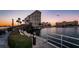 Scenic waterfront pathway with bridge and bench at sunset at 4550 Cove Cir # 804, St Petersburg, FL 33708