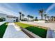 Outdoor bocce ball court with artificial turf and palm trees at 5120 Marina Way # 2201, Tampa, FL 33611