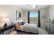 Bedroom with black and white decor and a pink accent chair at 515 Mangrove Shade Cir, Apollo Beach, FL 33572