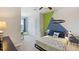 Bedroom with a fun, surf theme and built-in desk area at 515 Mangrove Shade Cir, Apollo Beach, FL 33572