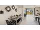 Modern dining area with metal table and woven chairs at 515 Mangrove Shade Cir, Apollo Beach, FL 33572