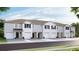 New townhome community with attached garages and neutral color palette at 515 Mangrove Shade Cir, Apollo Beach, FL 33572