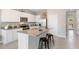 Modern kitchen with granite countertops and stainless steel appliances at 515 Mangrove Shade Cir, Apollo Beach, FL 33572