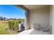 Covered lanai with outdoor seating and backyard view at 515 Mangrove Shade Cir, Apollo Beach, FL 33572