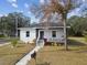 Modern craftsman style home with dark brown accents and walkway at 524 S Grosse Ave, Tarpon Springs, FL 34689