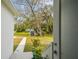View of backyard with storage shed and walkway at 524 S Grosse Ave, Tarpon Springs, FL 34689