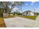 Concrete patio and grassy area at 524 S Grosse Ave, Tarpon Springs, FL 34689