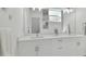 Modern double vanity bathroom with white cabinets at 524 S Grosse Ave, Tarpon Springs, FL 34689